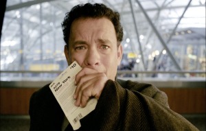 One cannot help but be reminded of the fate met by the character played by Tom Hanks in The Terminal, Steven Spielberg’s 2004 movie. A citizen of the fictional country of Krakozhia, Viktor Navorski finds himself trapped at a terminal in New York’s John F. Kennedy Airport after a civil war breaks out in his home country.